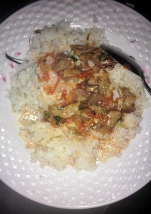 A picture of Beef stew and Rice.