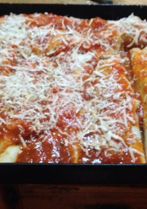 Una foto de Canelones de verdura con salsa