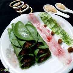 Spinach Patishapta Crepe/Pancake with khoya Coconut filling A picture of Spinach Patishapta Crepe/Pancake with khoya Coconut filling.