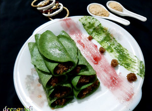 A picture of Spinach Patishapta Crepe/Pancake with khoya Coconut filling.