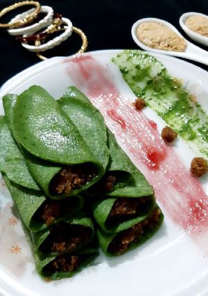 A picture of Spinach Patishapta Crepe/Pancake with khoya Coconut filling.