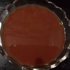 A picture of Tomato & tamarind chutney/sauce.