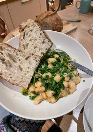 A picture of Miso Butter Beans with leeks and spring greens (GF, VG).