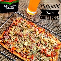 A picture of Punjabi thin crust pizza.