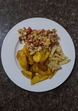 A picture of Fried Plantain and Irish Potatoes serve with fried eggs.