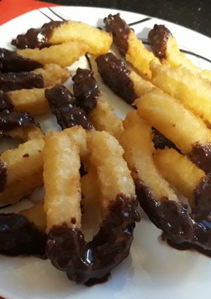 A picture of Churros with Chocolate Sauce.