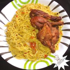 A picture of Spaghetti and fried chicken.