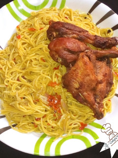 A picture of Spaghetti and fried chicken.