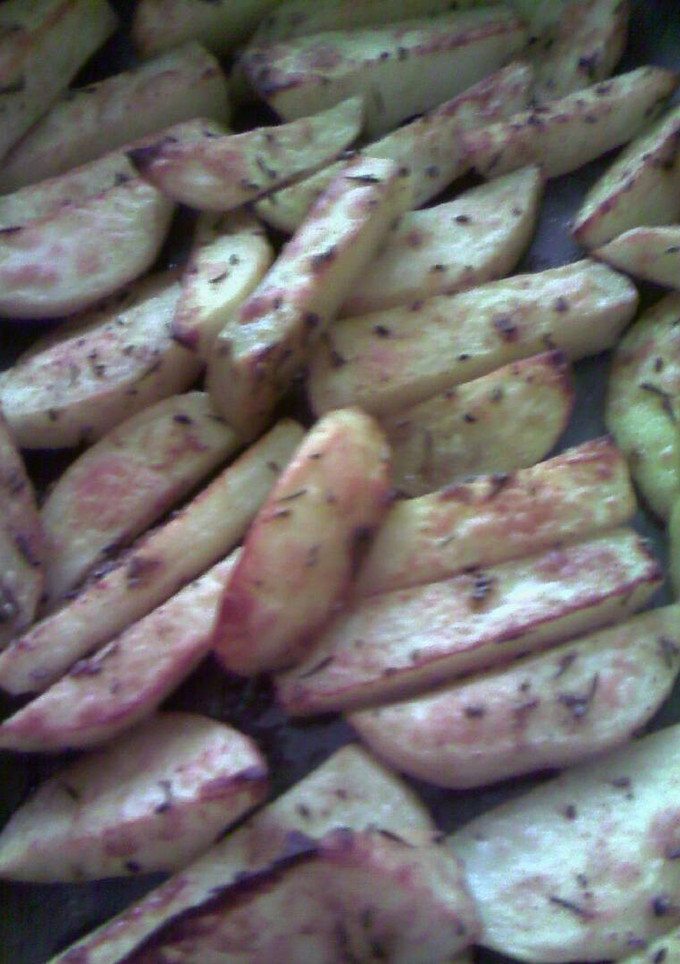 Una foto de Patatas especiadas fritas al horno