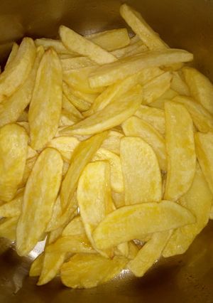 A picture of Deep fried potato wedges.