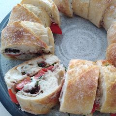 Goat's cheese, red capsicum and olive tapenade sandwich A picture of Goat's cheese, red capsicum and olive tapenade sandwich.