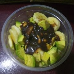 A picture of Simple pudding with chocolate fudge with nuts melted.