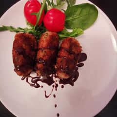 A picture of Duck croquettes w/chocolate spicy dipping sauce.