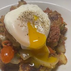 A picture of Spicy Corned Beef Hash with Poached Egg.