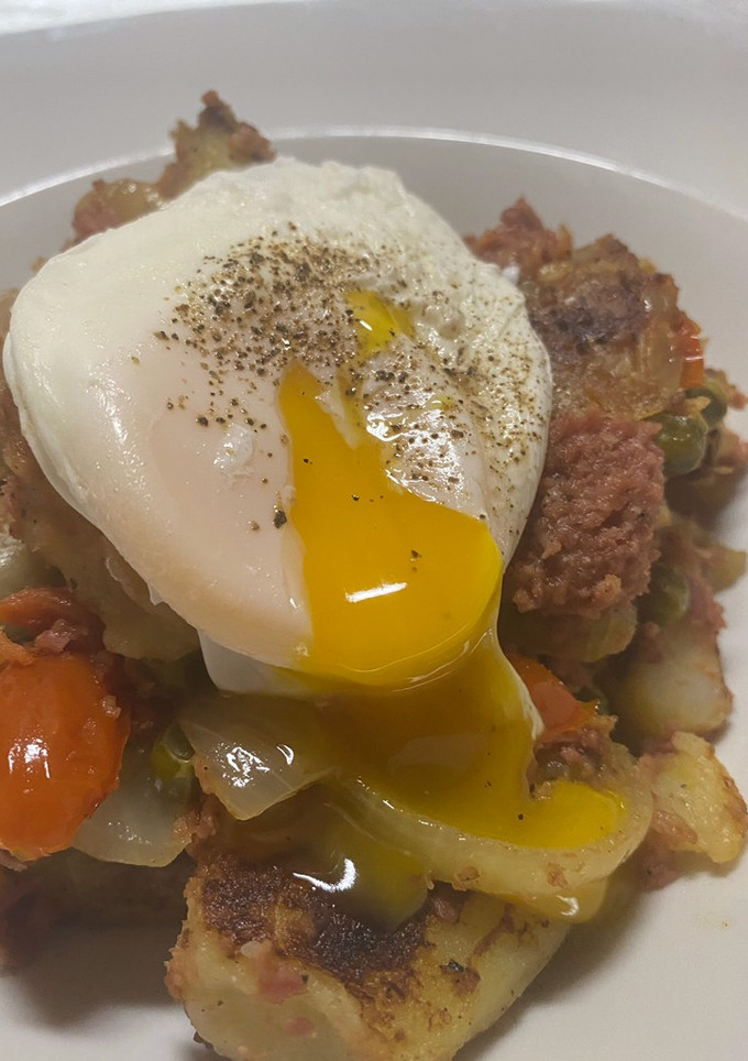 A picture of Spicy Corned Beef Hash with Poached Egg.
