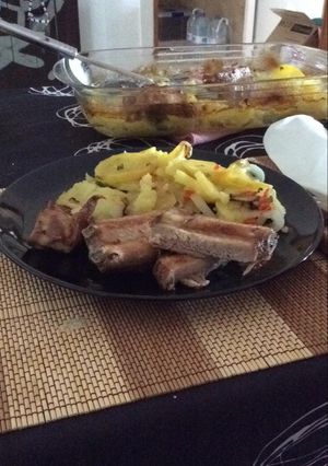 Una foto de Costilla con patatas Codorniu