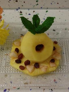 Una foto de Postre templado de piña y manzanas