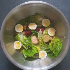A picture of Dressed Lettuce Salad.