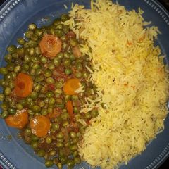 A picture of Rice with fried peas.