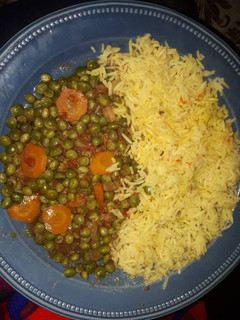 A picture of Rice with fried peas.