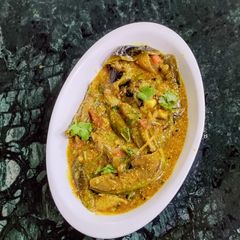 A picture of Achari Baingan(Eggplant With Mustard Paste).