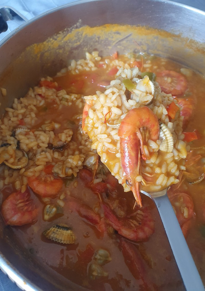 Una foto de Arroz caldoso de gamba roja y berberechos