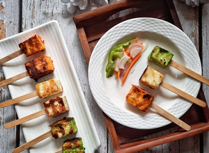 A picture of Tri colour paneer tikka popsticks.