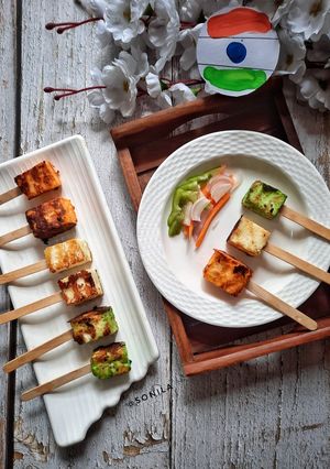 A picture of Tri colour paneer tikka popsticks.