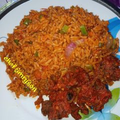 A picture of Jollof rice and sauced beef my way.