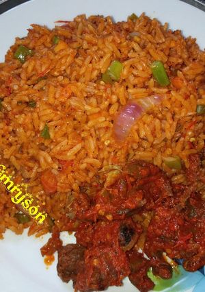 A picture of Jollof rice and sauced beef my way.