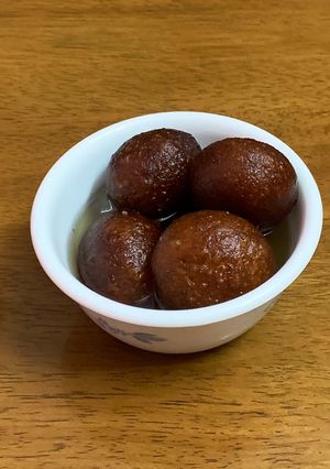 A picture of Gulab jamun with milk powder.