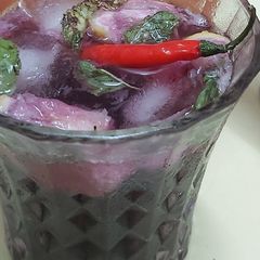 A picture of Thai red chilli Kala khatta mojitto.