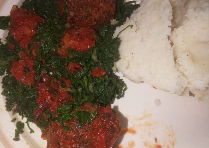 Ugali served with Meatballs and sukuma wiki