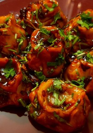 A picture of DEVIL MOMOS | SPICY VEGETABLE MOMO IN Chilli GARLIC SAUCE.
