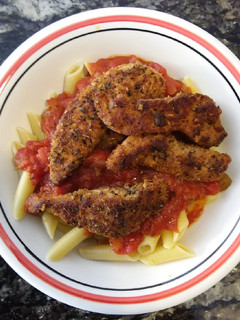 A picture of Cajun Chicken over Pasta.