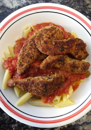 A picture of Cajun Chicken over Pasta.