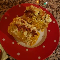 A picture of Corn with cheese 🧀 🌽.