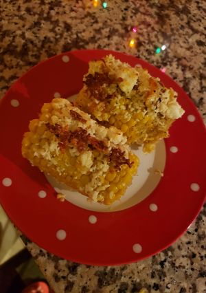 A picture of Corn with cheese 🧀 🌽.