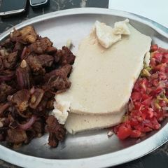 A picture of Beef fry & Ugali.