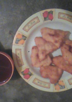 A picture of Coffee and maandazi.