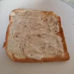 A picture of Spread on toast with leftover bread toast.