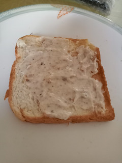 A picture of Spread on toast with leftover bread toast.