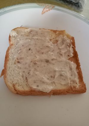 A picture of Spread on toast with leftover bread toast.