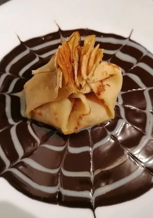 Une photo de Aumônière de crêpe pomme 🍎 poire 🍐 chocolat 🍫