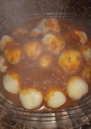 Una foto de Ñoquis de harina rellenos de mozzarella