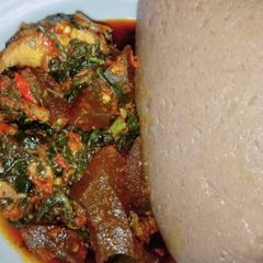 A picture of Vegetable soup with wheat swallow.