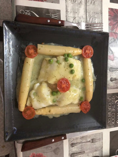 Una foto de Bacalao en salsa verde