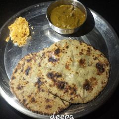 A picture of Bajra rotla with sarso ka saag.