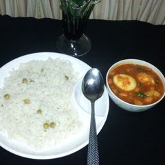 A picture of White rice and potatoe stew.