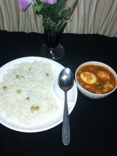 A picture of White rice and potatoe stew.